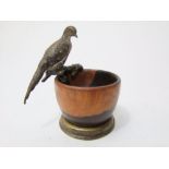 A turned Lignum vitae bowl surmounted by a cold cast and painted bronze figure of a cock pheasant,