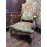 A late 19th century open elbow chair with hand worked medieval style tapestry seat and back, the