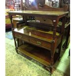 A late Victorian/Edwardian oak three tier buffet with architectural rail, turned supports and two