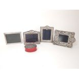 Four modern sterling silver picture frames to include one by Carrs of Sheffield embossed with