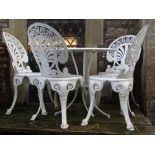 A cast aluminium garden terrace set comprising circular table and four fan backed chairs with