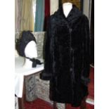 Ladies vintage faux fur coat with button front and applied decorative detail to collar and cuffs,