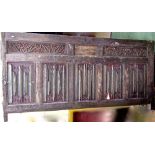 A substantial and very early oak coffer front of large proportions with five linen fold and two