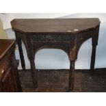 An 18th century credence/side table, the central drawer with geometric carved detail and turned