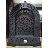 A Rippingilles cast iron room heater case with cast and pierced floral and geometric detail