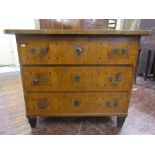 A late 18th century continental commode of three long drawers veneered in walnut with further