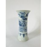 A large Chinese blue and white vase of cylindrical form with flared neck and painted decoration of