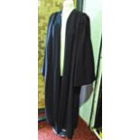 Academic black gown by J. Wippell & Co together with ecclesiastical black gown with dog collars