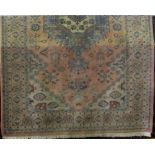 A wool rug in a Persian style with pale fawn ground, geometric detail within running borders,