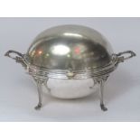 A regency style silver plated revolving breakfast dish with fitted interior