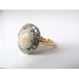 A claw set opal and rose cut diamond ring in 18ct gold, size I/J, 5.5g