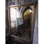 A 19th century style wall mirror, the mirror plate set within gilded and moulded frame, 140 x 110