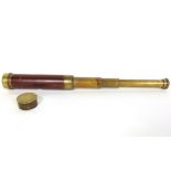 A 19th century brass and mahogany draw telescope.