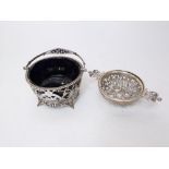 A pierced silver dish with long handles, London 1894 and a sugar basin with pierced framework and