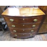 A Regency mahogany bow fronted chest of four long graduated drawers raised on swept supports with