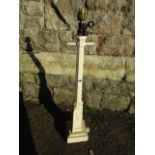 An unusual vintage cast iron lantern in the form of a Victorian street light raised on a square