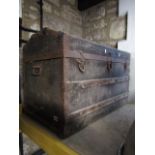 A late 19th century travelling trunk with domed top with timber lathes