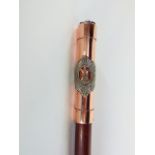 A military walking stick with cast metal knop with the badge of the Royal Scots Regiment.