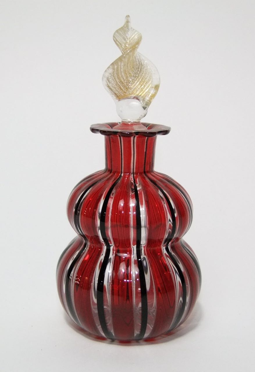 A hand blown glass scent bottle of double gourd form, possibly Italian, with lamp work striped