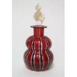A hand blown glass scent bottle of double gourd form, possibly Italian, with lamp work striped
