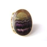 A 9ct oval Blue John ring in art nouveau style mount, size K, 10g