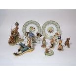 A collection of Capodimonte figure groups including a sportsmen and dogs together with a baby and