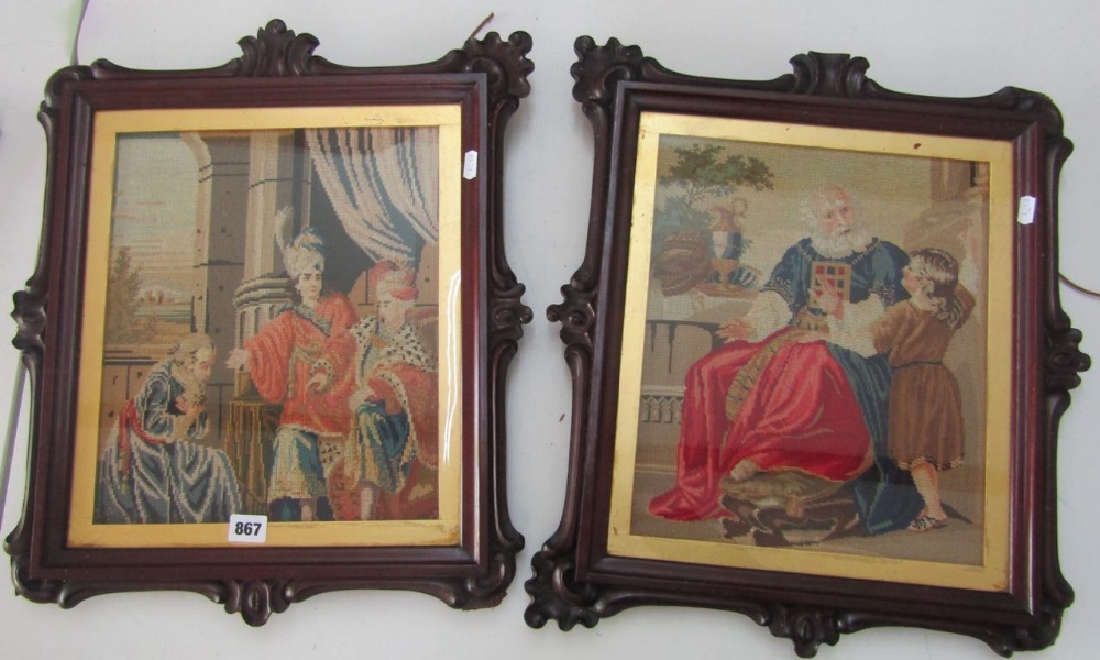 A pair of 19th century needlework panels in carved and shaped wooden frames and gilt slips,