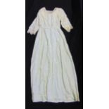 Vintage wedding dress in embroidered silk with lacework to cuffs and neckline, together with a