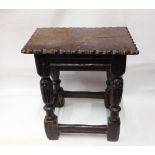 An antique oak joint/coffin stool with carved detail to legs and top