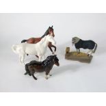 A Beswick model of a brown Sheltand type pony, together with two Beswick matt glazed models, one