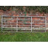 A galvanised iron field gate, 3 metres in length