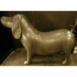 A stylised dog with tan coloured leather finish, 80 cm in length