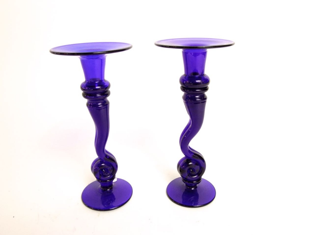 Pair of Bristol blue glass candlesticks on stylized columns