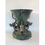 Interesting Japanese bronze jardiniere of tapered form, held aloft by three coiled serpents upon a
