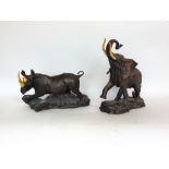 Franklin Mint bronze study of a rhinoceros with gilt horns; together with a further Franklin Mint