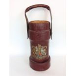 Morocco red leather shell carrier with further leather handle decorated with a polychrome Royal