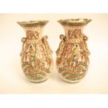 A pair of late 19th century Satsuma vases with simulated gilt tassel decoration to the neck with