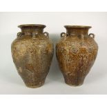 A pair of large oriental vases of shouldered form with applied loop handles to the shoulders and