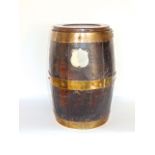 Oak and brass bound lidded barrel, with un-engraved white metal crest and copper rivets, 40cm high