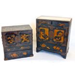 Two similar Japanese lacquer table top cabinets, each fitted with cupboard doors concealing