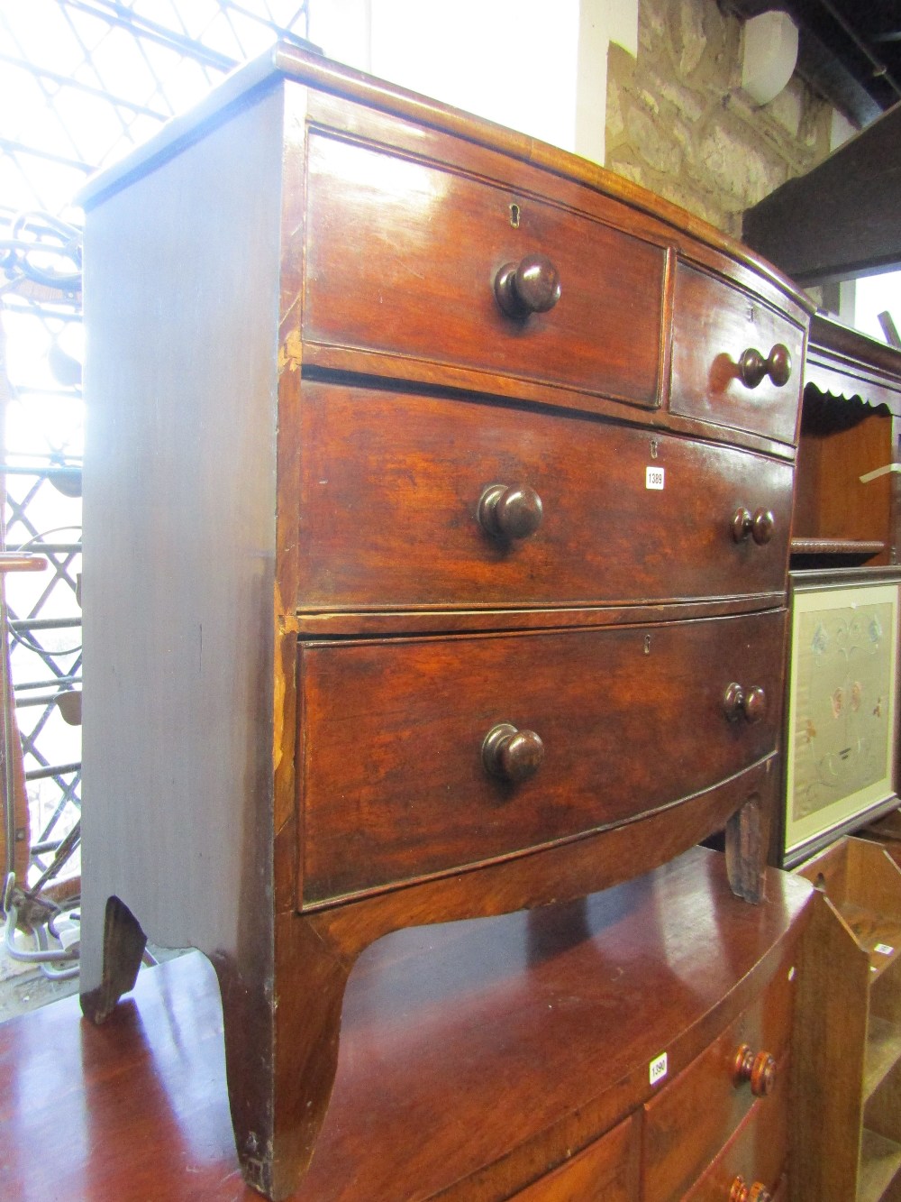 A 19th century mahogany bow fronted bedroom chest of two long and two short drawers with shaped