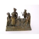 A 19th century cast brass group, Indian military court martial, 13 cm