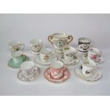 A collection of Royal Crown Derby coffee cans and saucers including examples in the Chinese Birds