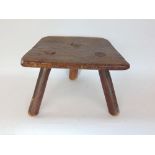 Antique elm seated milking tool, with primitive top upon three legs