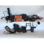 A box containing a large collection of vintage camera equipment to include Canon and others,