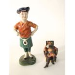 A Royal Doulton figure - The Foaming Quart HN2162, together with a pottery figure of a standing