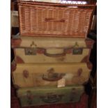 Collection of vintage luggage to include three leather bound canvas trunks and a wicker hamper