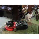 A Homelite HR-18XL petrol driven rotary lawn mower with Briggs and Stratton series 220 engine