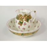 A Victorian Minton's jug and basin set with simulated gilt ribbon detail and printed and infilled