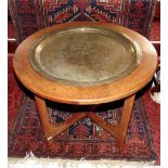 Interesting eastern hardwood table, centrally fitted with a copper tray engraved with a Buddhistic
